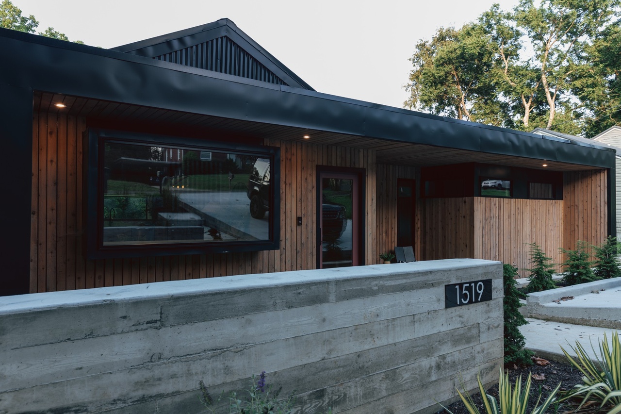 Norvel street frontage with a deep horizontal frame and recessed timber enclosure